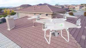 drone flying over residential roof